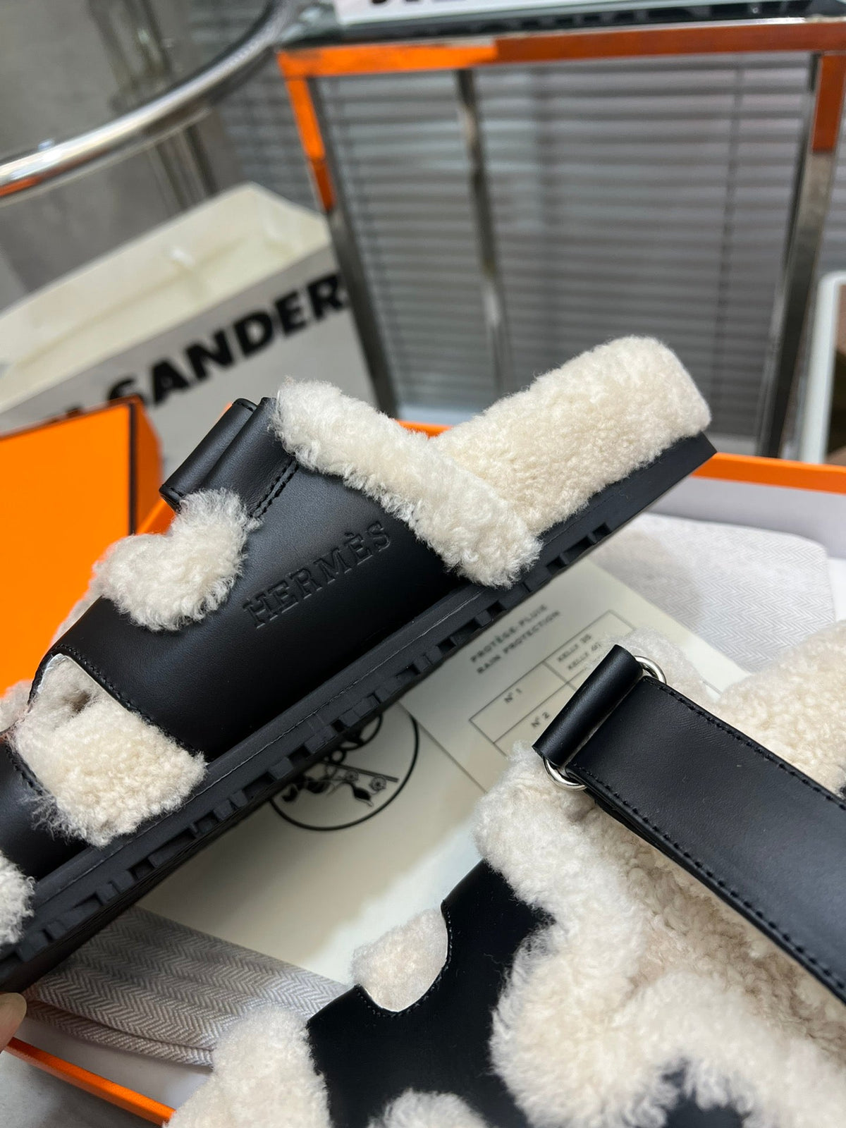 Hermes Chypre Slippers in Beige Lamb Wool and Black Calfskin