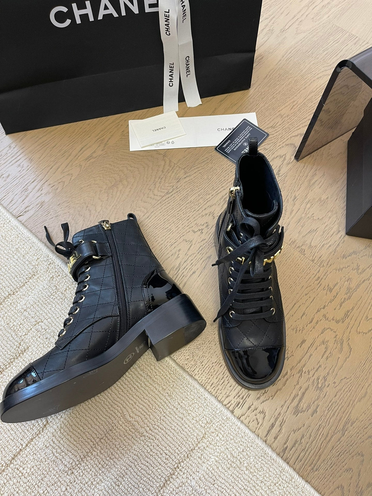 Chanel Alphabet Martin Boots in Black Lambskin