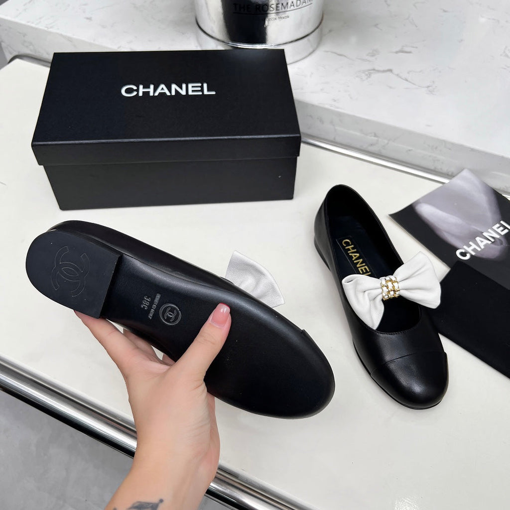 Chanel 25S Mary Janes in Black Calfskin with White Bow Gold Hardware