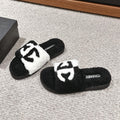 Chanel Slippers in Black Mix White Fleece