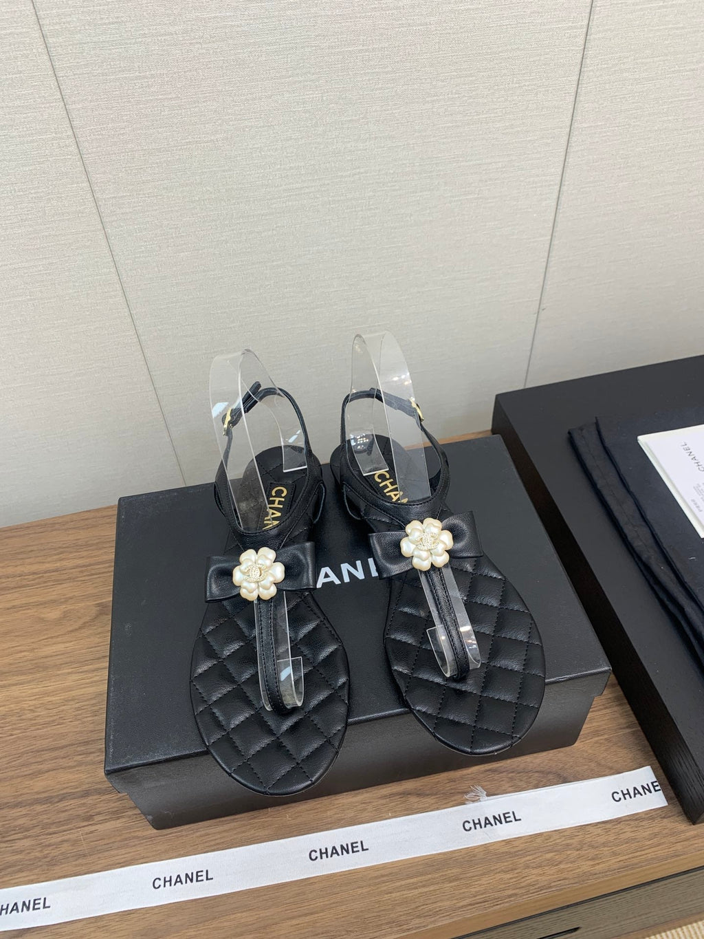Chanel Thong Sandal in Black Lambskin with Pearl Flower