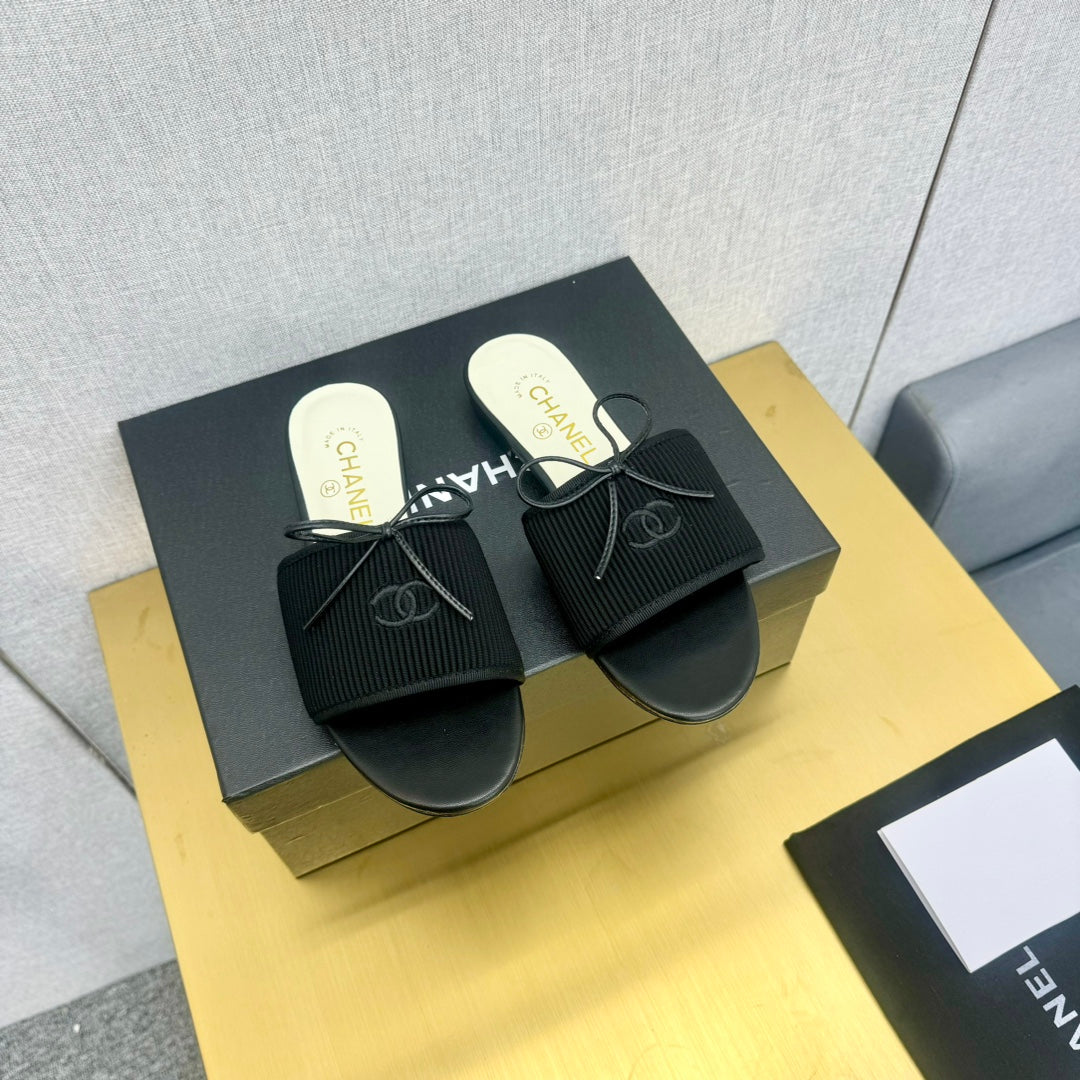 Chanel Bow Slippers in Black Lambskin